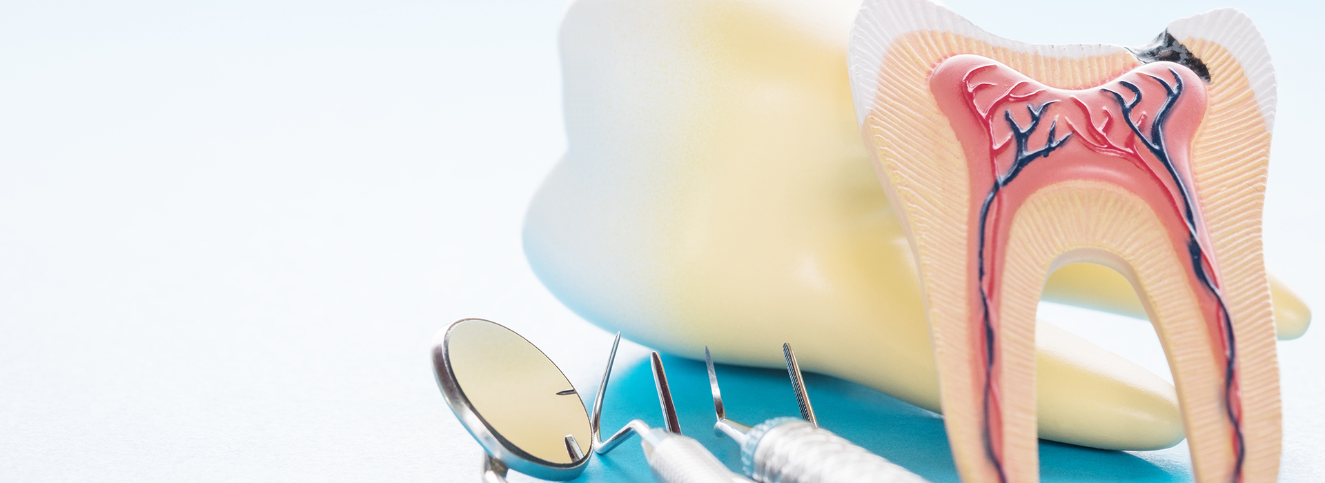 The image shows a close-up view of dental tools including a toothbrush, dental floss, and dental picks, with a focus on oral hygiene.